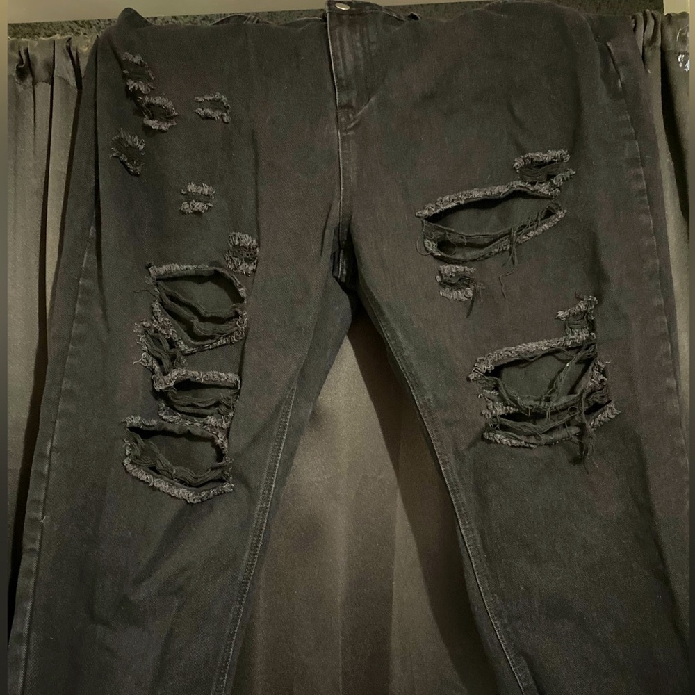 Black ripped jeans. Open pockets, high waist